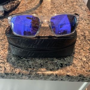 Oakley polarized, clear frame, purple lenses.  Worn 1 time